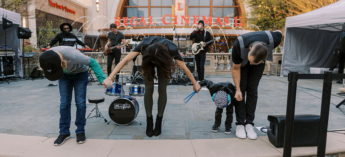 Jax takes a bow after he plays drums live on stage!