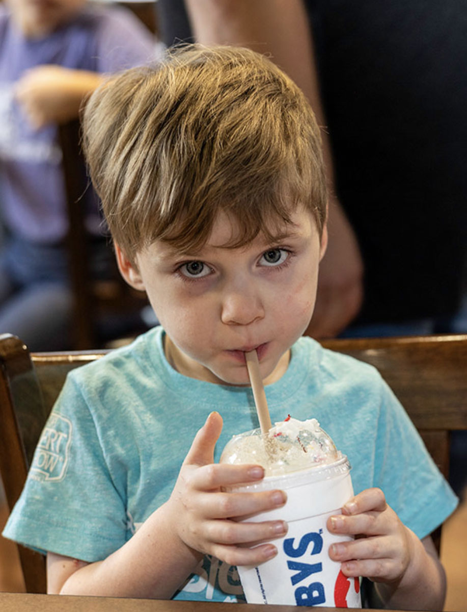 Isaac enjoys a Zaxby's Milkshake